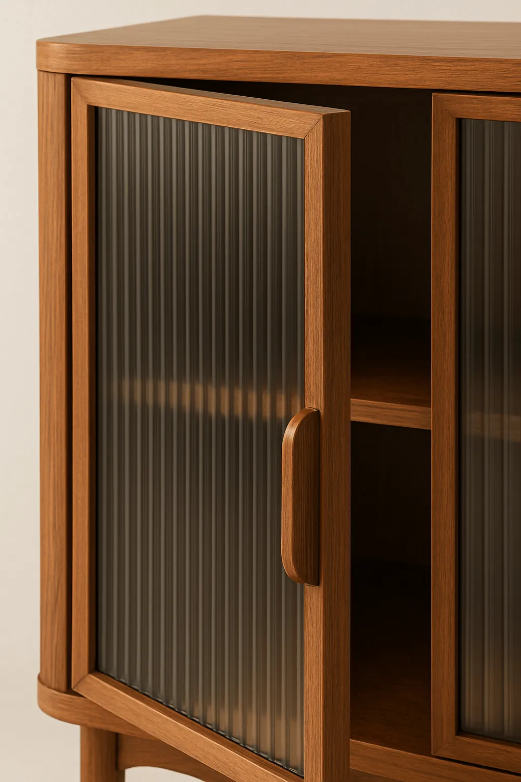 A wooden cabinet with doors of fluted glass